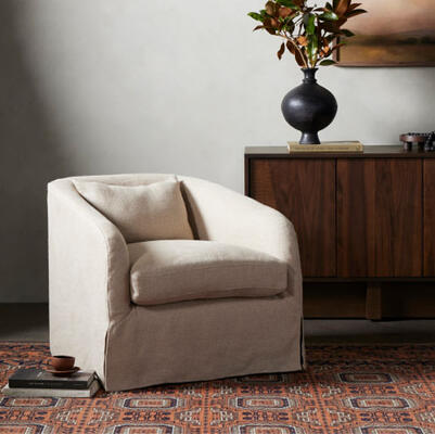 The new Topanga slipcover swivel chair from Four Hands features a fully removable, machine-washable Belgian linen slipcover that brings a laid-back look to a classic shape 