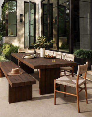 Take it outside and make room for everyone. The Encino outdoor dining table and bench, both crafted from reclaimed wood, are paired with Lomas outdoor dining chairs made of all-weather wicker