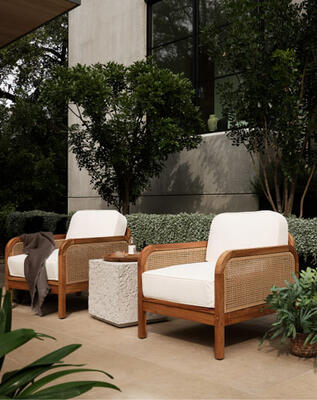 Styling outdoors with organic-inspired materials—like the Merit outdoor chairs framed in FSC-certified teak—just feels natural