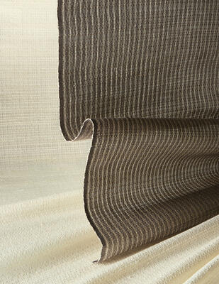 Loomed by hand of lightweight banana fiber, the understated Dash series, in four tonal colorways, layers easily with a range of styles. A random weft pattern produces the design’s subtle horizontal dash, creating a contemporary twist on classic striped patterns