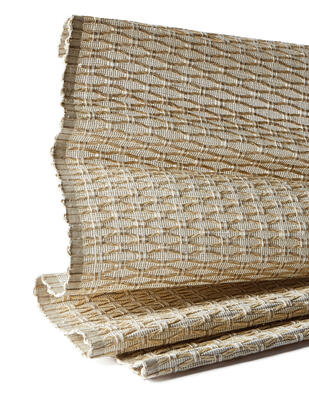 Meticulously jacquard hand-loomed, the limited-edition Plait series lends an artisanal look to an interior. Dimensional strands of natural banana fiber are braided by hand and woven into a ramie ground in an undulating pattern, the complex layering of textural materials yielding rich, organic beauty